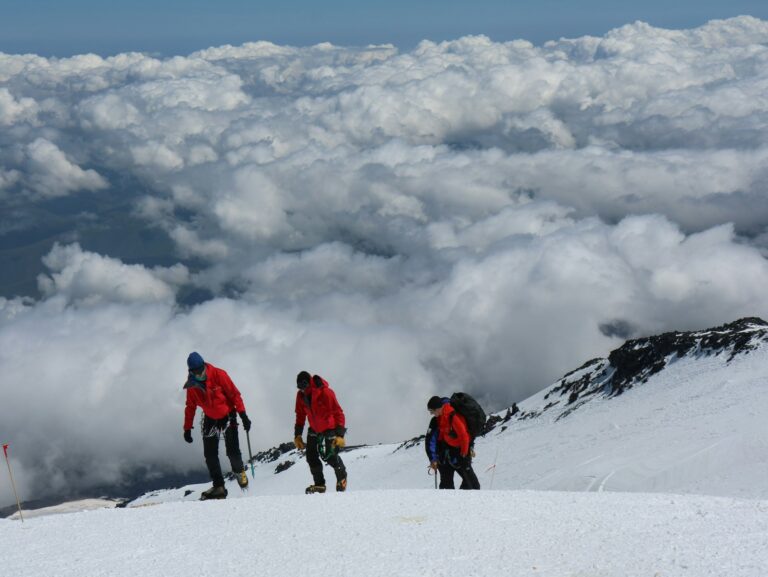 tourist walking on top of mount Kilimanjaro